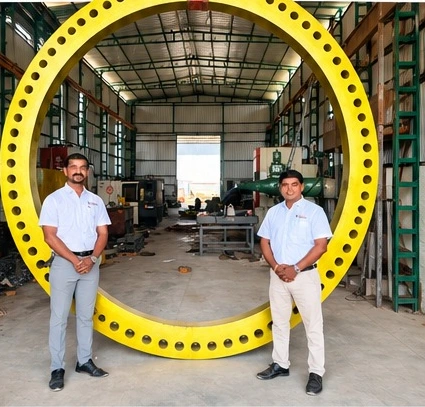 Large industrial ring displayed on the factory floor